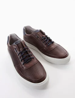 sneakers fondo in gomma e soletto interno in vera pelle. Tomaia in morbidissima pelle nappata intrecciata con particolarissima foratura su entrambi i lati testa Uomo Sneakers